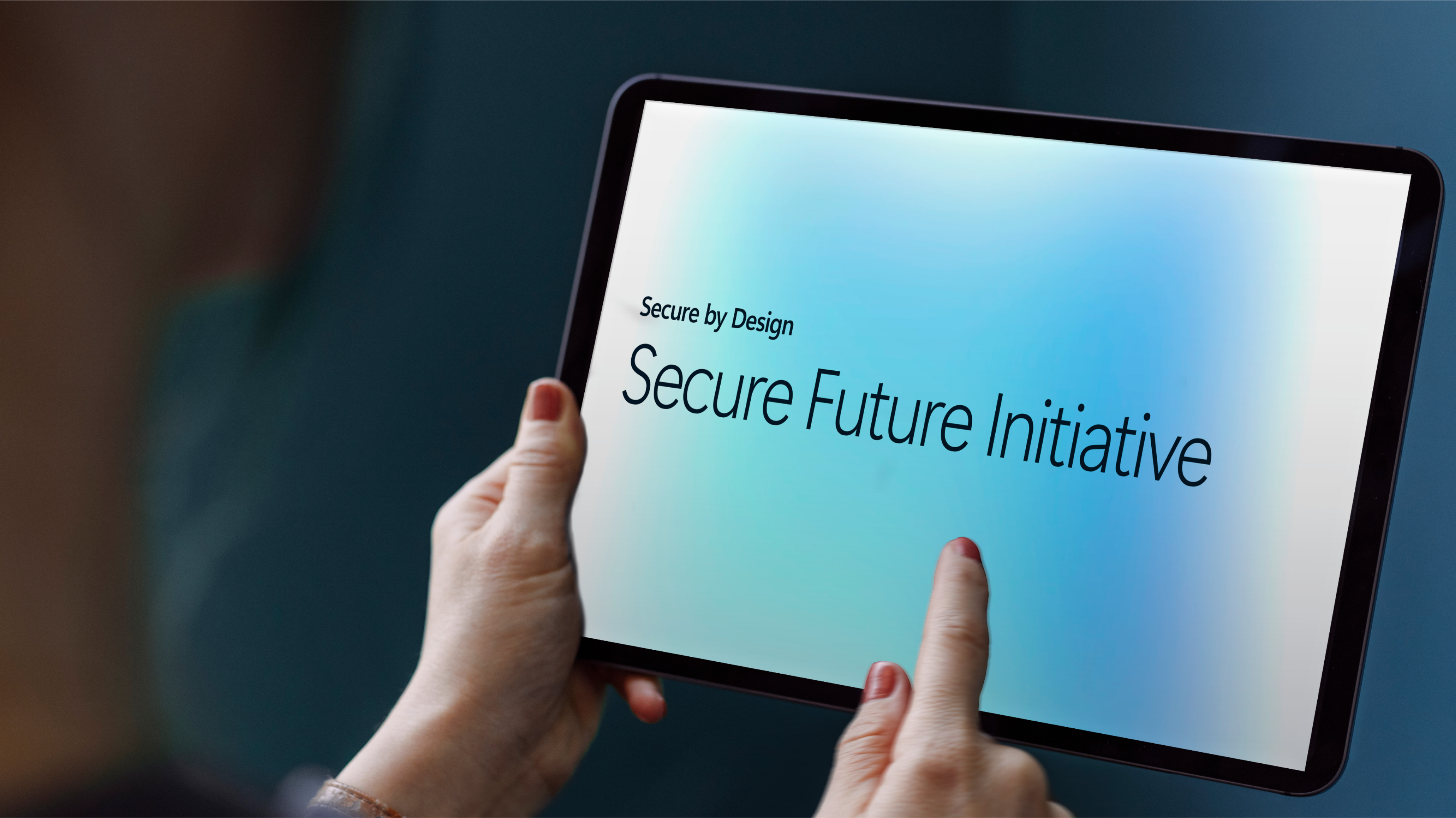 Hands holding a tablet with a screen
