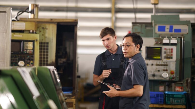 Technicians inspect CNC machines using computer controlled software programs.